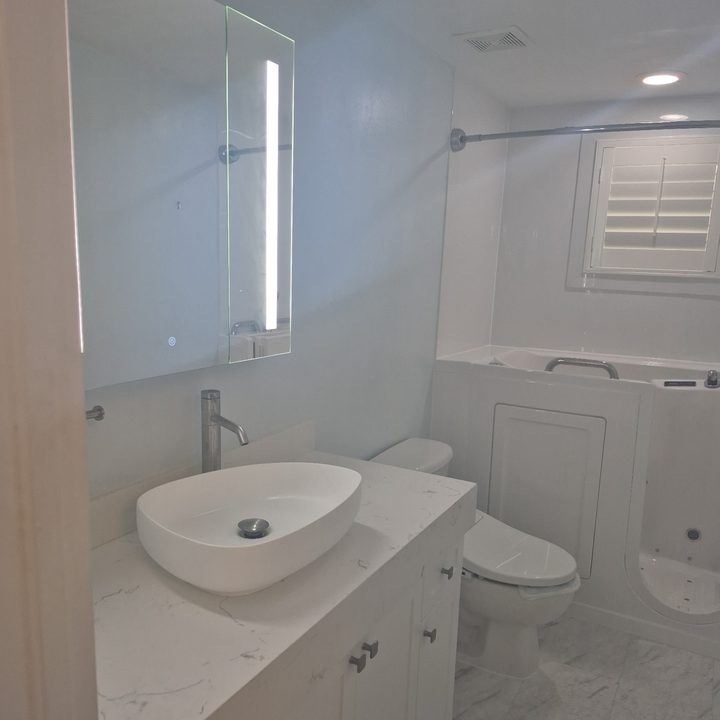 Remodeled bathroom with a vessel-sink vanity