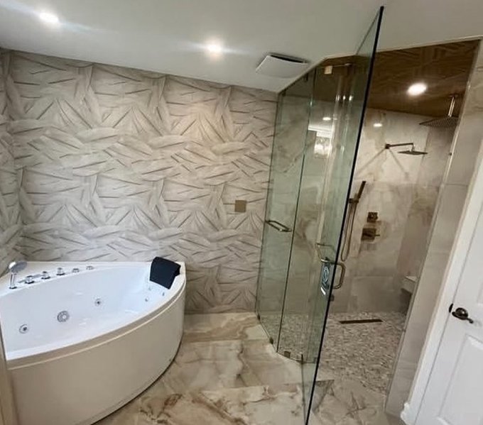Master bathroom remodel with a soaking tub and glass shower