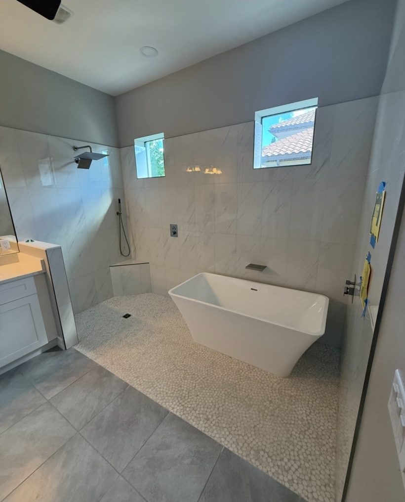 Full bathroom remodel with a freestanding tub and walk-in shower
