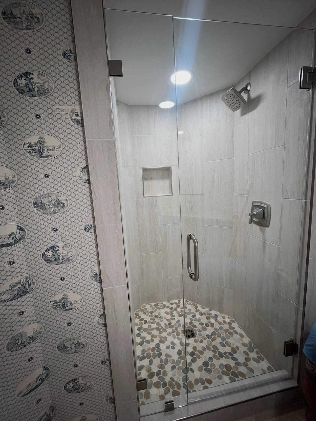 Custom marble tile walls in a tub-to-shower conversion